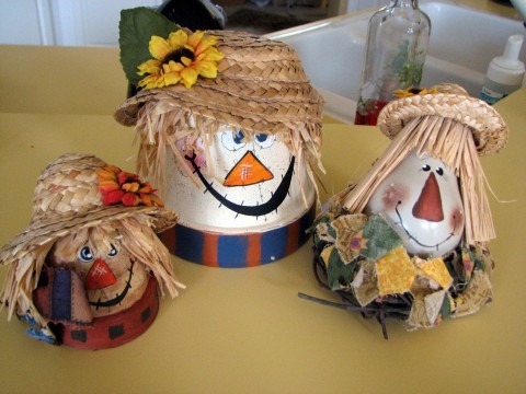 The flower pot scarecrows, and light bulb scarecrow are on the kitchen 
