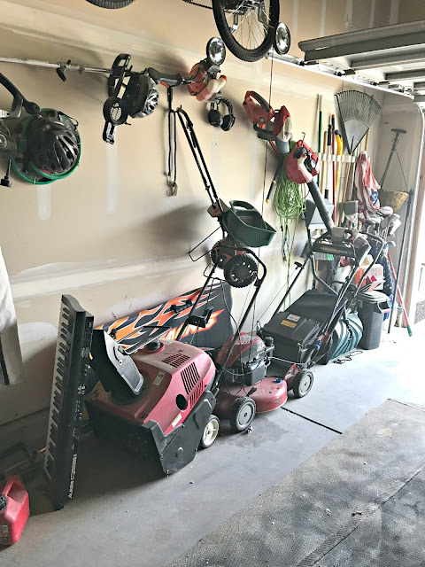 Organizing lawn equipment in garage