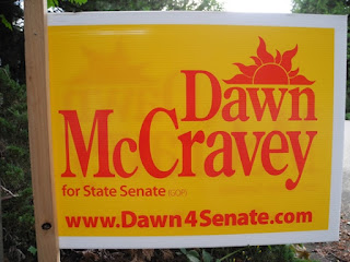 A Dawn McCravey sign. The larger ones aren't any easier to find her party on.