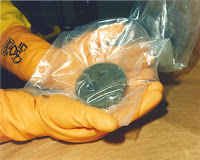 Plutonium held in hands of a nuclear worker