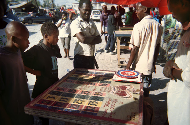 kids gamble roulette game in the street