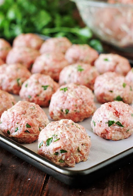 Sheet of Formed Unbaked Meatballs Image