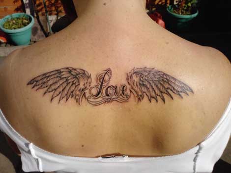 Back Tattoos For Guys Wings. lower ack tattoos wings.