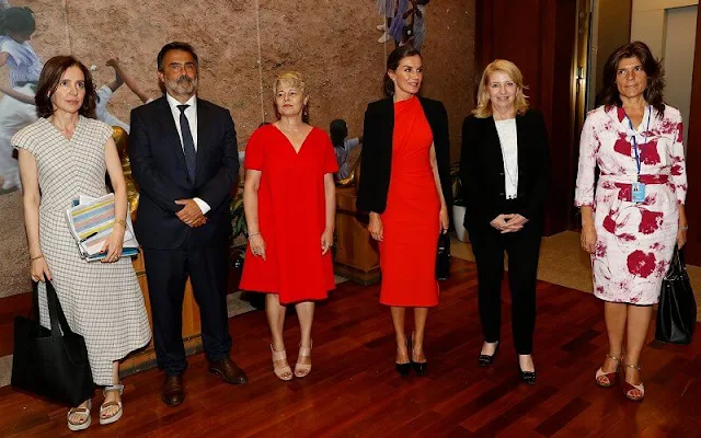 Queen Letizia wore a new red narciso rodriguez gathered midi dress by Zara. Executive Director Catherine Russell and Qu Dongyu