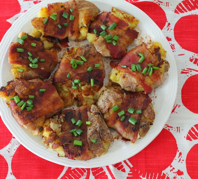 Food Lust People Love: Small red potatoes, cooked to tenderness then smashed flattish, covered with bacon and fried till crispy. You can serve these as a side dish but they also make a fabulous main course alongside a big salad or vegetables.