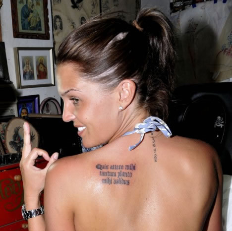 Ms Lloyd also has a Latin phrase on her back left shoulder which reads