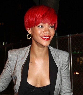 rihanna hair red curly. rihanna red hair dye.