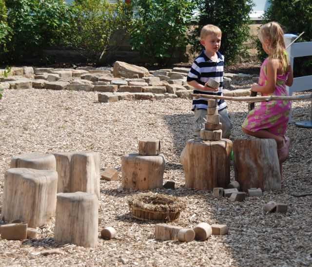 These stumps were so nicely sanded that there was not a splinter to be found. Behind the stump area is swirling stone labyrinth. 