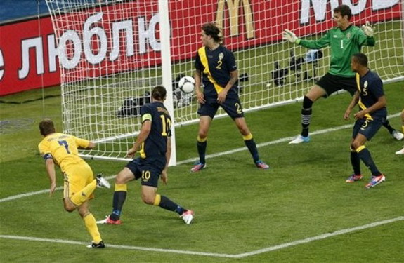 Ukraine forward Andriy Shevchenko scores his side's winning goal against Sweden