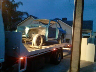 Volvo 122S on a trailer after painting