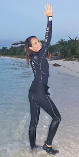 wetsuit model on beach