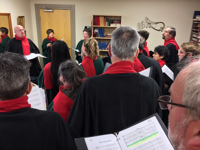 Pierre warms the choir up before the Dec 9, 2018 performance