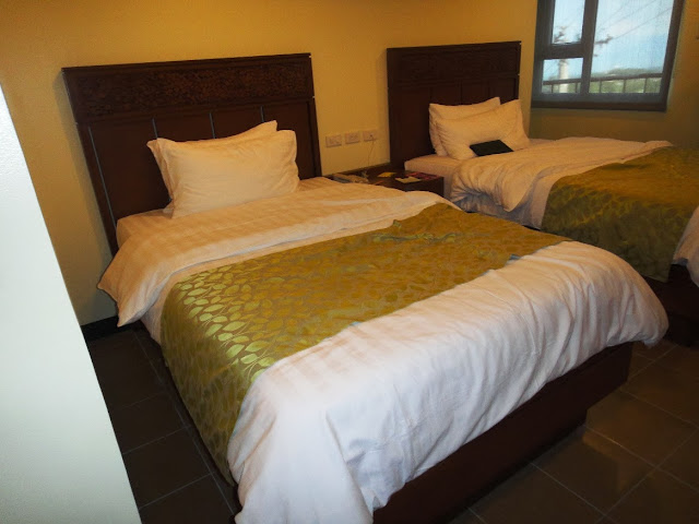 Two Twin size bed inside Canyon Woods hotel