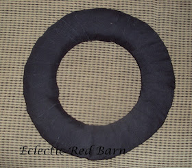 completely wrapped straw wreath with black fabric