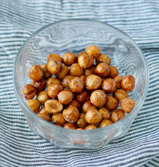 Roasted and peeled hazelnuts in a bowl