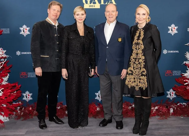 Princess Charlene wore a navy blue boucle cropped jacket pantsuit by Akris, wide-leg trousers by Ralph Lauren