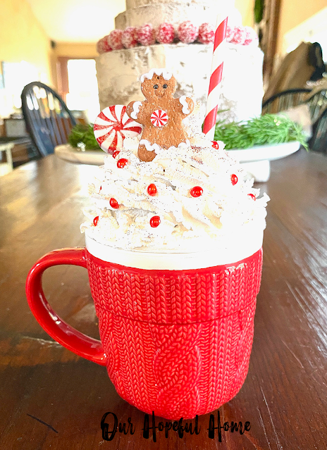 red Christmas mug with whipped cream topper