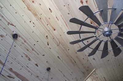 Kitchen remodel with vaulted ceilings, finished with tongue and groove pine and windmill fan from Shades of Light