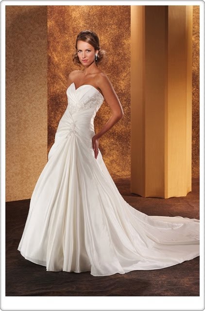 Strapless gown with a sweetheart neckline The lace trimmed empire waist is 