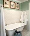 WHITE AND GREEN BATHROOM IDEAS SOURCE RUSTIC ROOSTER INTERIORS BEAUTIFUL BATHROOM WITH PARTIALLY TILED WHITE SUBWAY TILE WALL AND MARBLE BLACK WHITE AND GREEN BATHROOM IDEAS د
