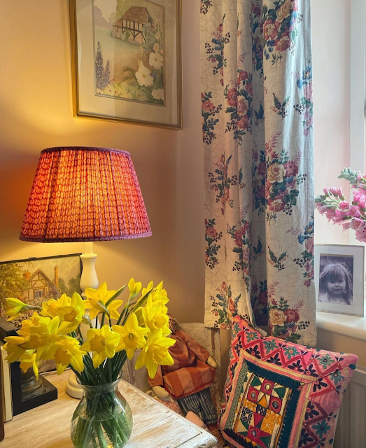 daffodils and floral curtains in an English cottage