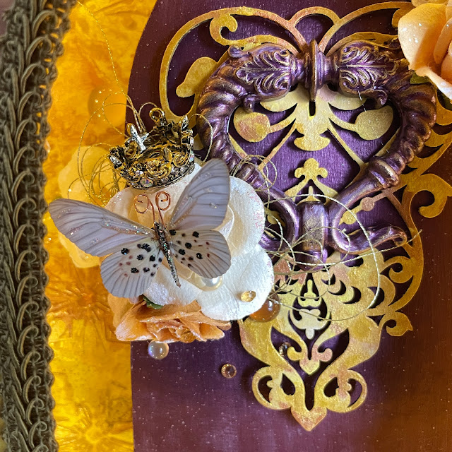 Golden Shrine made with Prima flowers, chipboard, melange, paint, memory hardware; Reneabouquets butterfly; Tim Holtz tiny lights and Pinkfresh crystals