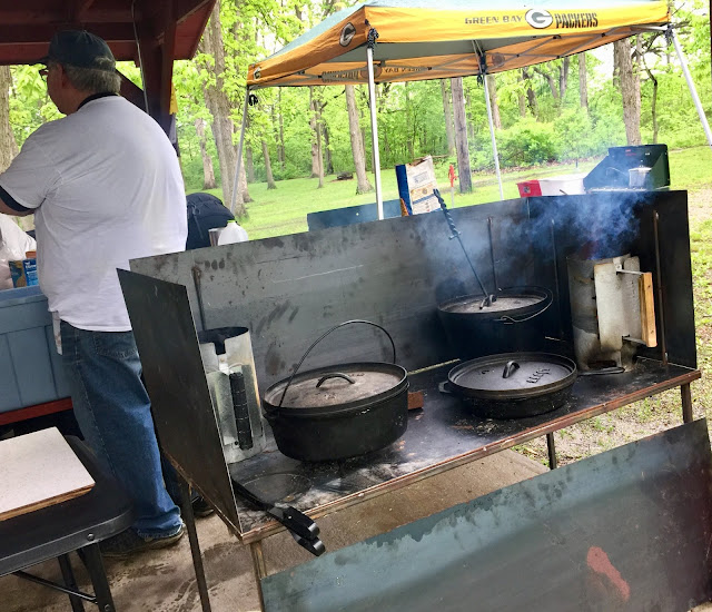 Dutch oven cooking on a metal table