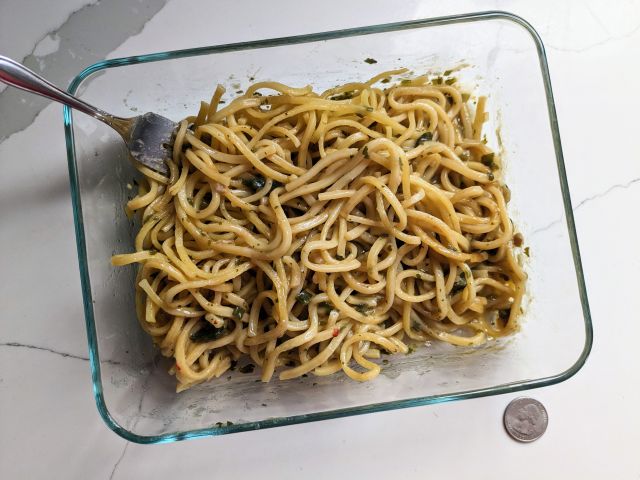 A glass tray full of Trader Joe's Garlicky Pasta.