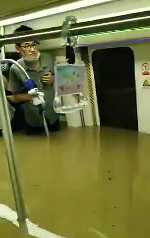 Subway Passengers Trapped In Floods In China