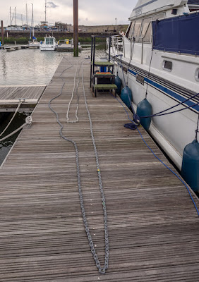 Photo of Ravensdale's anchor chain laid out on the pontoon