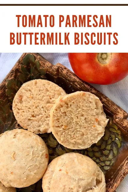 Close up of a split open tomato Parmesan biscuit.