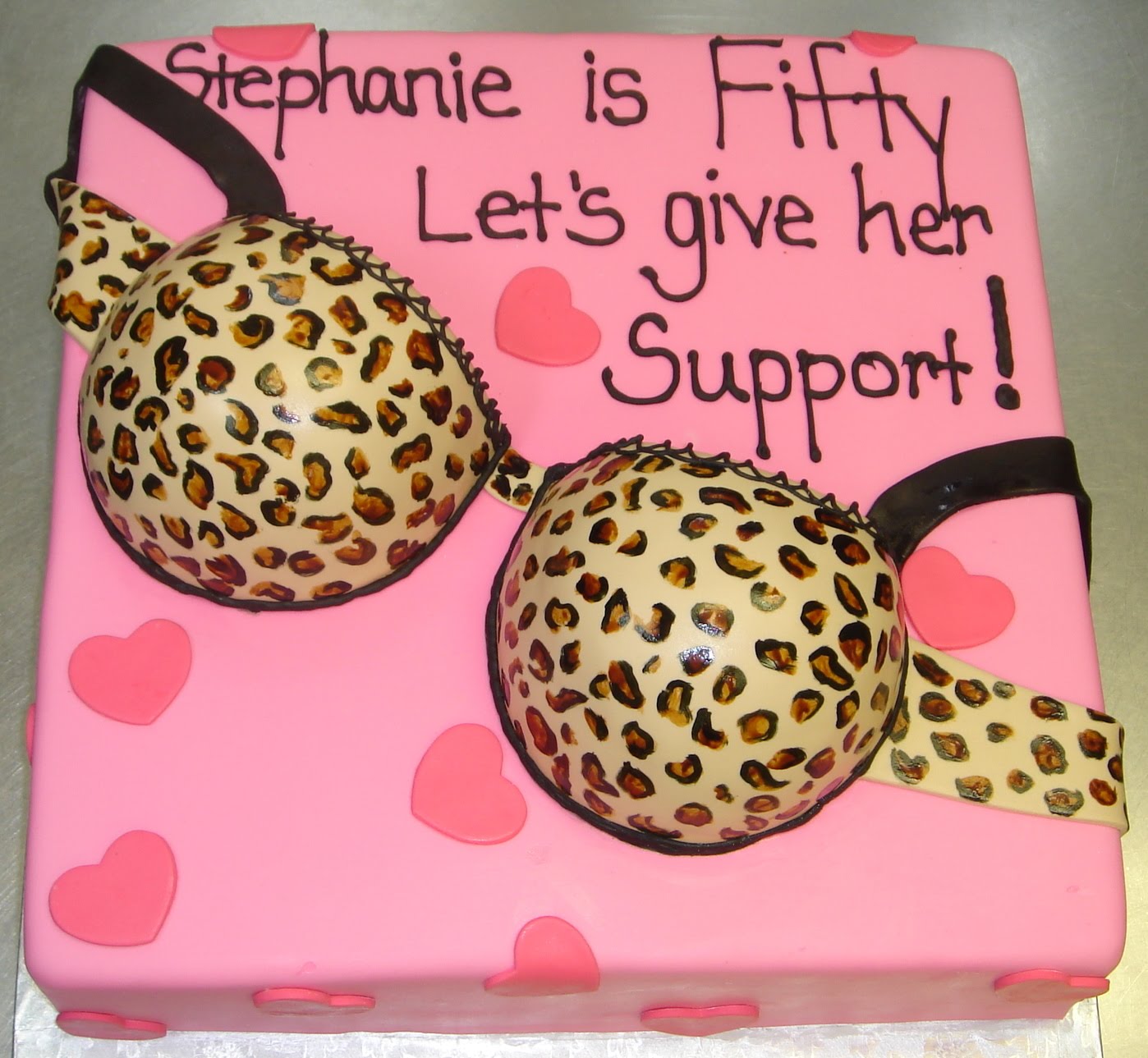 ... print sexy bra 50th birthday cake with pink base cake and hearts