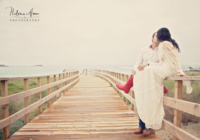 bride and groom kissing at the beach