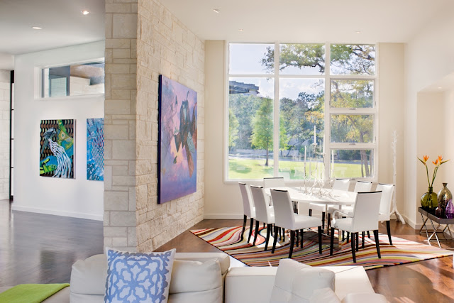 Photo of open modern dining room with white furniture