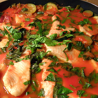 Frying Pan with Fish Dish Topped with Chopped Basil