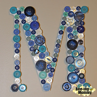 gallery wall, button monogramed letter, blue button monogramed letter, teal button monogramed letter, button letter, button initial, button wall decor, button monogram, monogramed letter, DIY button monogramed letter, DIY button letter, DIY monogramed letter, button craft, button M, monogramed wall, monogramed M, easy monogramed letter, easy letter, easy wall letter, DIY wall letter, buttons, button art, nursery decor, room decor, wall decor, button craft, monogram, monogram art, monogram decor, blue wall decor, blue letter,