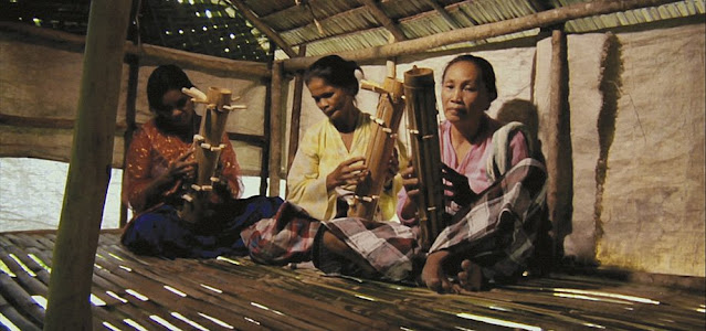 Palawan women playing bamboo zithers