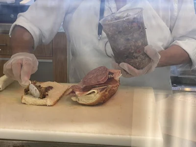 making mufaletta sandwich at Genova Delicatessen in Walnut Creek