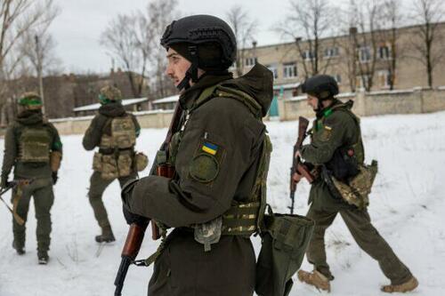 Ukrainian soldiers patrol in Bakhmut, eastern Ukraine, on Feb. 14, 2023.