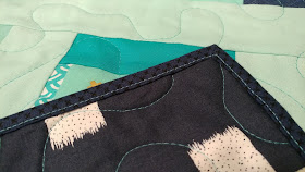 Detour quilt in aqua and navy from Stash Statement quilting book by Kelly Young