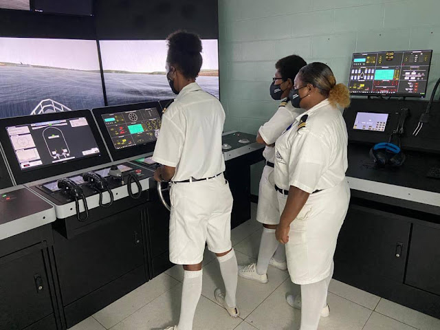 PNG young female cadets showing their navigating skills at the Maritime College in Madang