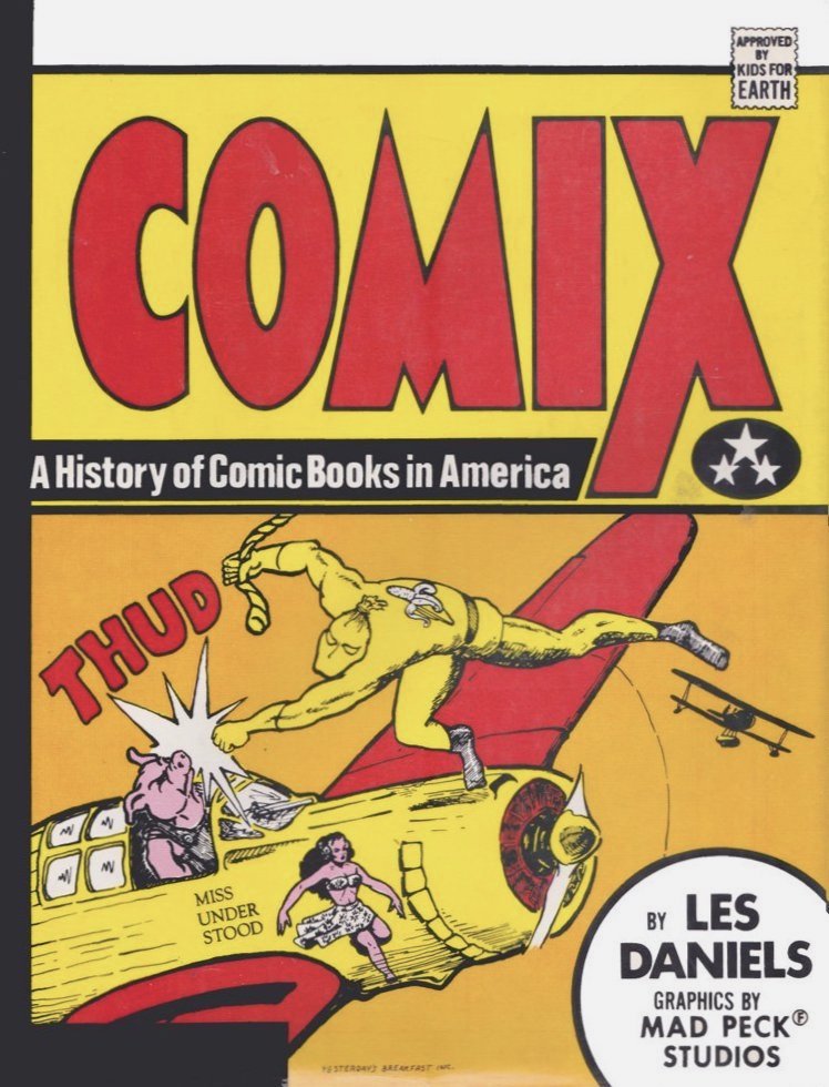 Cover to 'Comix: A History of Comic Books in America' showing a masked character in yellow costume with banana on the back punching the pilot of a plane with a 'Thud'