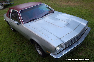 Bulging hood was factory on this silver 1975 Chevy Monza Towne Coupe.