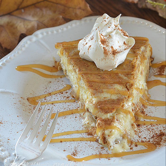 Slice of pumpkin cheesecake with caramel drizzle