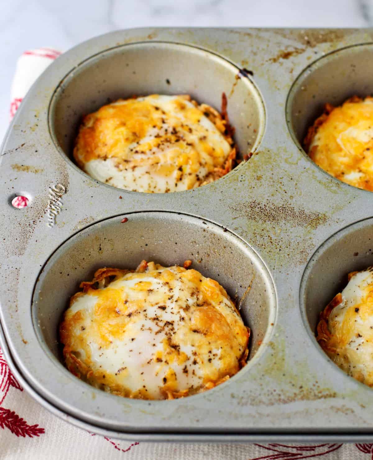 Baked Eggs in Hash Brown Potato Nests in a muffin tin.