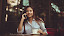 Portrait of Young Woman Using Mobile Phone in Cafe