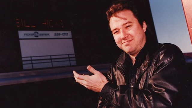 Awesome Bill Hicks wearing black leather jacket smiling