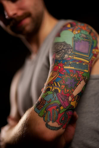 half sleeve tattoo ideas for men. Colorful array of toys tattoo.