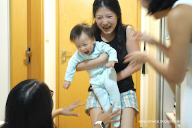 Baby Playing with Ninangs