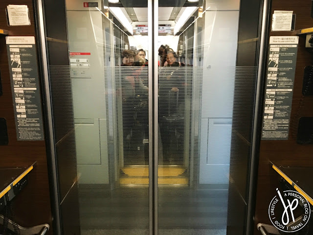 train glass door, group of people looking